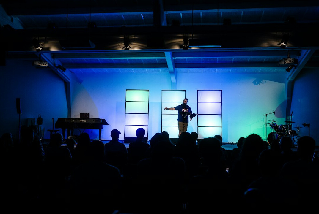 Empty conference stage with microphone and spotlight